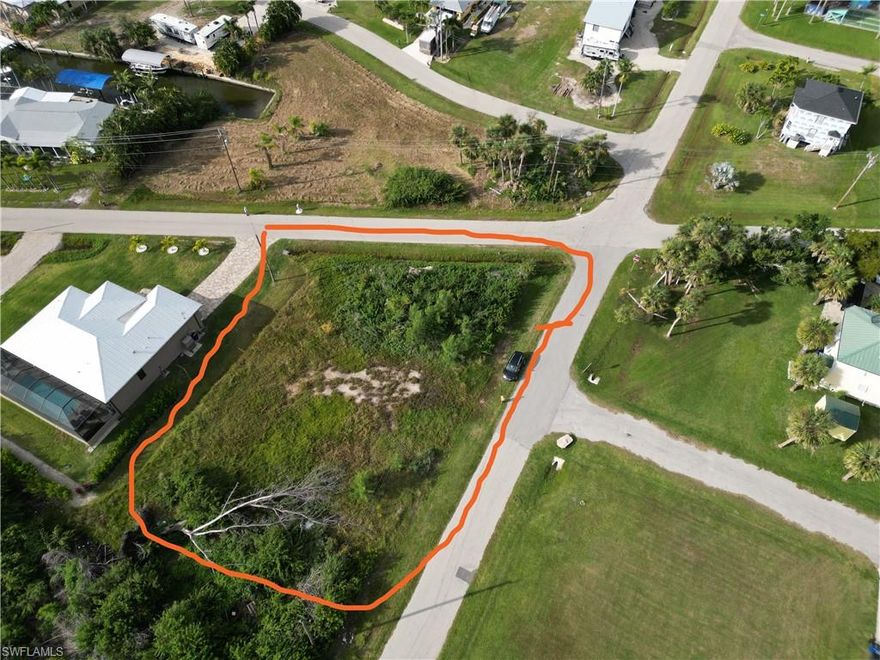 Oversized prime residential lot near the heart of Saint James City, a laid-back boating/waterfront community located on the southern tip of Pine Island in Lee County, Florida. Quiet neighborhood near a pocket park. Lot is mostly cleared. Elevation approx. 3-4 feet, Floodplain AE8 Elevation. Water available.  $4,773.00 utility connection fee. Dimensions of parcel: 112 x 174 x 102 x 130