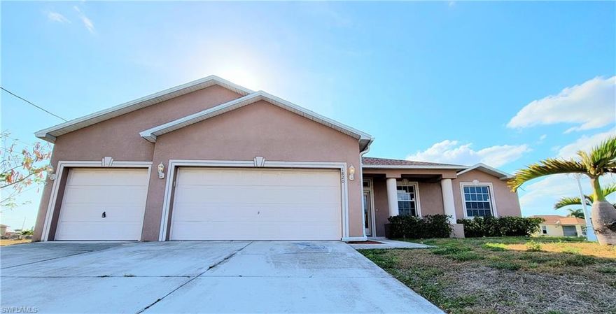 RARE FIND and priced to move! This MASSIVE open concept 4 bedroom 3 bath 3 car attached garage surrounded by 4 empty lots! Close to everything in North Cape grocery stores, shopping dining, etc.  Completely remodeled with brand new flooring and paint in every room, many new light fixtures, professionally cleaned, turn key ready to move in for your personal touches and style.  Center great room, kitchen features unique HUGE WALK IN PANTRY.  Giant master suite on the left side of the home has tons of natural light, double his and hers closets, and a spacious master ensuite with dual sinks and a separate soaking tub, shower and toilet room.  To the right of the great room are 3 bedrooms and 2 baths, everyone gets their own bathroom. Extremely large and deep garage dimensions... Man cave or workshop of your dreams. Enjoy beautiful Florida sunsets on spacious rear, west facing lanai.