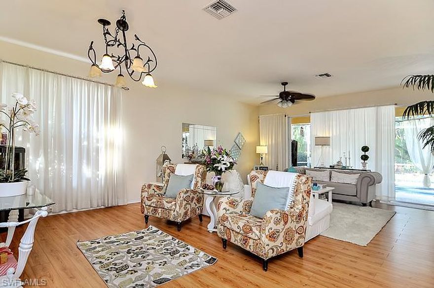 Masterful Marsh Landing!! Absolutely stunning home with open floor plan, large back yard and private heated swimming pool! Low Community Fees!! Features of this beautiful move-in-ready home include upgraded flooring, designer touches throughout, large expansive kitchen, custom fans and fixtures, freshly painted exterior, brand new pool pump, and much more! Marsh Landing is perfectly located across from Coconut Point, shopping, dining, and all that Southwest Florida has to offer!!