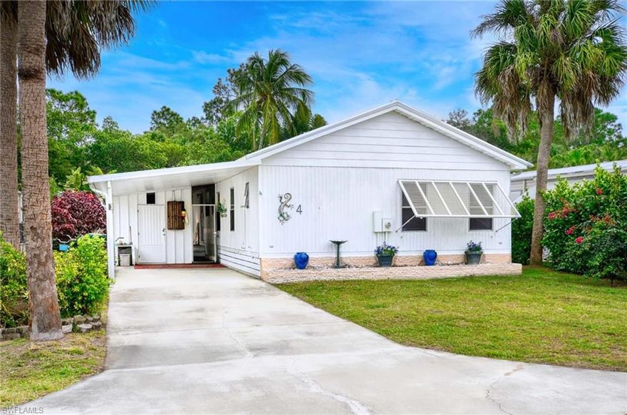 This beautifully maintained inside & out 1983 double wide home offers 3 spacious bedrooms and 2 full bathrooms. Located on a desirable water-indirect lot with a brand-new 2025 dock- perfect for fishing, boating, or relaxing by the water. This property offers water-indirect access to the GULF through tranquil waterways, making it a dream come true for those who love fishing, boating, and enjoying the waterfront lifestyle. The landscaped backyard includes a large paved area ideal for entertaining and enjoying Florida's outdoor lifestyle. The screened-in-lanai provides a cozy space for reading, dining, or simply unwinding while listening to nature. Inside, the open floor plan is bright, spacious, and airy, creating a comfortable flow throughout the home. Large windows wrap around the rear of the house, flooding the space with natural light and offering breathtaking water and natural preserve views, ensuring privacy in a peaceful and serene atmosphere. This community has no HOAs, not a 55+ community and is not a co-op. You own your own land. One of a kind! An optional Club & Boat membership is available and includes access to a pool, spa, activity room, shuffleboard, BBQ area, full kitchen, tables, & chairs & a pool table. The Boat Club offers boat slips, dock, boat washing, storage and boat ramp. This community is nestled in a highly sought-after location ideal for boating enthusiasts!  W/D in side residence. It's a must see.