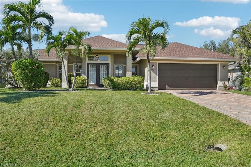 Why wait to enjoy the Florida lifestyle when this move-in-ready pool home already has the big-ticket items taken care of? Major recent updates provide immediate peace of mind, including a BRAND-NEW A/C installed April 2026, a NEW ROOF (2023), a NEW pool cage (2023), a NEW variable-speed pool pump 2025, and a white privacy fence installed in 2023, along with manual hurricane shutters for added storm protection. An assumable flood insurance policy at just $1,522 per year adds exceptional value and savings for the next owner. 

Step inside to soaring vaulted ceilings that create an open, airy feel, complemented by a cozy built-in fireplace and a stylish dry bar or coffee nook that’s perfect for entertaining guests or starting your day. The spacious kitchen features granite countertops and sleek stainless-steel appliances, offering the ideal blend of functionality and modern design for everyday living. Out back, your private oasis is ready to enjoy year-round. The heated chlorine pool invites relaxation in every season, while the oversized screened lanai and pool deck provide plenty of space for gatherings, quiet evenings, or soaking up the Florida sunshine. With its desirable location, thoughtful updates, and move-in-ready condition, this home offers the perfect combination of comfort, lifestyle, and long-term value. Schedule your private showing today and experience the best of Cape Coral living before this opportunity is gone.
