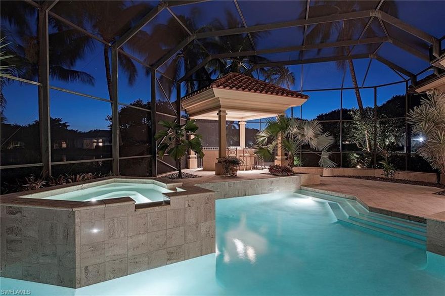 Welcome to the perfect blend of home and land.  Seller offering $150,000 credit at closing for any possible improvements a buyer may wish to make. This beautifully appointed custom-built home has currently undergone a minor facelift, and the designer touches show beautifully. You will enjoy the easy flowing floor plan with en-suite guest rooms and spacious areas to entertain. The gourmet kitchen with walk-in pantry opens up to the media or family room and allows the chef to participate in family fun. The private master suite is everyone’s dream with dual bathrooms, walk-in closets and wonderful extras. This south-facing property which boasts over 200 feet of waterfront, breathtaking views and golf course vistas is truly one of a kind. Enjoy outdoor living with a resort-style pool and spa and a free-standing Tiki hut complete with outdoor kitchen and new appliances. Designed to perfection for a comfortable and gracious lifestyle, there is no other Naples property quite like it.