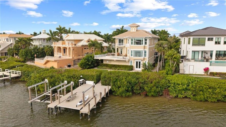 A rare boating-and-beach opportunity in Barefoot Beach on one of the community’s most desirable waterfront sites. The home is in pristine condition with a new roof, all windows and doors are impact-rated or shuttered, elevator services all 3 floors, raised pool/spa, and a fully equipped dock with 16K lift + platform lift for kayaks/jet skis. Direct Gulf access and a short walk to the beach — very few properties offer both.


The home lives large with 5,079 sq ft, 4 bedrooms + study, 4.5 baths, and an additional 1,432 sq ft on the lower level (boat room, exercise room, game room, oversized 3-car garage). The primary suite has panoramic water views that truly sell the home.


The property has been lovingly maintained — it shows beautifully and is easy to preview. This is a strong value for Barefoot Beach, especially given the waterfront position, condition, and boating setup.


If you are looking for beach proximity, boating, privacy, and a move-in-ready home, this is one of the best opportunities in the community right now.