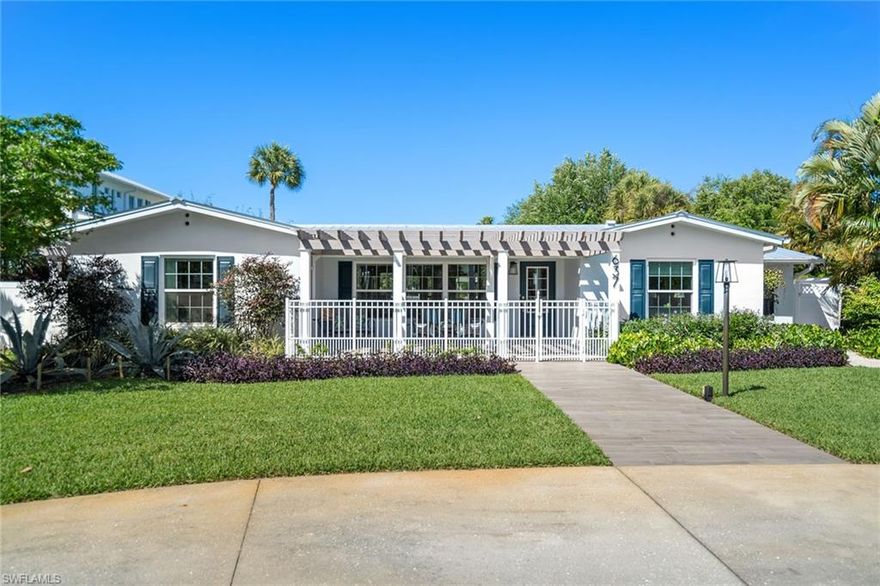 Just three blocks from the Gulf of Mexico, this cozy 1940s beach cottage in Old Naples has been remastered top to bottom with the finest attention to detail - sitting on almost half an acre with a spectacular lake view. The front porch welcomes visitors to sit and enjoy the beautiful garden and front yard. Inside, the entire home features wood-look tile floors, a custom island kitchen with quartz countertops, a complete primary bathroom renovation, impact glass windows & doors, a dog run, and a flex space for a home office or family room. The enormous new pool and outdoor living area have an unforgettable lake view along with a large fenced backyard. Two en-suite guest rooms also have new bathrooms and offer privacy and flexibility. New two-car garage with back street access, new roof, new laundry room, and an abundance of closets and storage throughout the home including a mudroom. Imagine being the next caretaker of this charming cottage, evoking the style and quality of life by the sea - just a short distance to the sugary white-sand beaches for which Naples is famous.