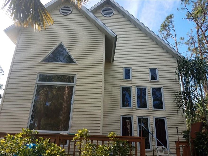 ***AS IS CONTRACT ONLY-CONVENTIONAL LOAN OR CASH BUYER NEEDED FOR APPROVED SHORT SALE***   BOY IS SHE A BEAUTY-LUCKY FOR YOU FHA BUYER LOAN DID NOT APPROVE OF UNSOUND DECK SO BACK ON THE MARKET! ONE OF A KIND HOME WITH 25 FT VAULTED CEILINGS! BEAUTIFUL VIEWS FROM ULTRA CONTEMPORARY DESIGNED WINDOWS. ENJOY YOUR OWN PRIVATE PIECE OF PARADISE WITH PRESERVE VACANT LOT NEXT DOOR.  2 MASTER SUITES WITH MASTER BATH JACUZZI TUB DOWNSTAIRS. UPSTAIRS MASTER BEDROOM HAS HIS & HER CLOSETS AND COULD BE CONVERTED INTO A 3 BEDROOM HOME.   STAINLESS STEEL APPLIANCES, UPDATED CHERRY WOOD CABINETS, 2012 AC UNIT & 2017 AC CONDENSER. A NAPLE'S UNIQUE MASTERPIECE WAITING FOR THE PERFECT OWNER. DECK NEEDS TLC. SILVER STAIRWAY MIRROR & HOT TUB DO NOT CONVEY.