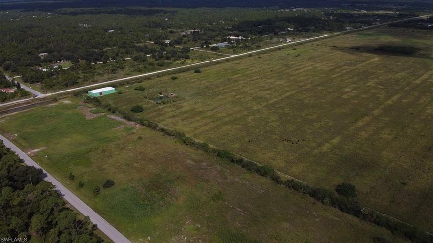 Exceptional acerage in Wheeler Estates (Hendry County) that is located right on the Lee County border. 104 acres of pasture land requiring very little clearing in preperation of development. Currently there is a 5,000 SF steel building located on the SW section of the property. Acerage just north of the property (another 100 acres) is owned by Hendry county and future development is for a water retention lake surrounded by a park. Brand new homes to the south of the property sold last year between $400,000 and $480,000. Excellent parcel for a major developer.