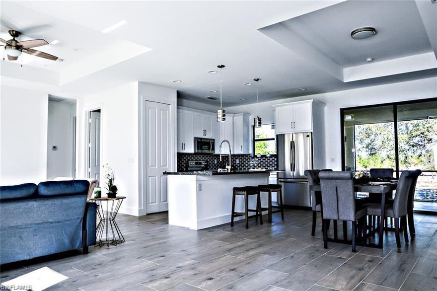 This luxurious New Construction Home is a bright and welcoming experience from the moment you walk in the front door. The splendid Villa model has three bedrooms, two bathrooms, generous living space, stylish finishes, and is filled with abundant natural light. An open-concept kitchen with a gorgeous island creates the optimal place to gather with friends and family. Every detail was carefully selected, and quality crafted. Highlights included porcelain tile 24 x 48, quartz countertops, crystal backsplash, finished wooden cabinets, impact windows and doors, screen lanai, and stainless steel appliances. This stunning one-story home is on a large lot in a peaceful and safe neighborhood, with a landscaped front yard and a huge backyard, there is plenty of space to build a pool. Great option for home buyers who want to move in worry-free. You can spend time enjoying your brand new home that leave you unconcerned for several years... Photos are from a previous model and for illustration purposes only, color, materials and style may change.