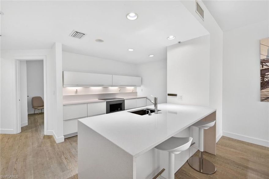 Experience elevated waterfront living in this beautifully updated high-rise condominium. Designed with a refined modern aesthetic, the residence features a fully renovated kitchen and baths design by Dino Raccanello, renowned Australian/Italian designer architect, blending sleek lines with sophisticated finishes. This spacious three bedroom, two-bath home offers 1,786 square feet of thoughtfully designed living space, enhanced by continuous laminate flooring throughout and an extended. Enjoy tranquil views overlooking the resort-style pool, spa, and marina, creating a serene backdrop for both everyday living and entertaining. Recent upgrades, including a newer air conditioning system and hot water heater, provide added comfort and peace of mind. North Star is set within 12 acres of gated waterfront grounds and offers an exceptional 15,000 square feet of resort-caliber amenities. Residents enjoy a sun-drenched southern-facing pool and spa, a state-of-the-art fitness and aerobics center, steam rooms, locker facilities, and inviting social spaces including billiards and card rooms, a business center, and a library. Outdoor enthusiasts will appreciate three pickleball courts and a tennis court. Boating enthusiasts can lease a slip in the marina, while a scenic waterfront promenade leads to four popular dining destinations. During season, take advantage of the complimentary trolley service to downtown Fort Myers’ vibrant River District, home to an array of acclaimed restaurants, boutique shopping, art galleries, and theaters.This residence offers a rare combination of modern design, resort-style amenities, and an unbeatable waterfront lifestyle. Reach out today to make this unique condo your own.
