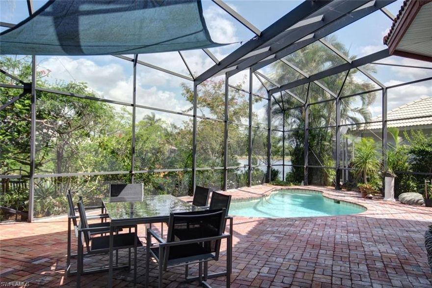 This home is located in the very quiet neighborhood of Chatham Point in Lely Resort’s Tiger Island Estates.  As you enter the home you will be amazed by how private it feels.  The entrance and courtyard have a Mediterranean flare and there is a tropical garden all around the outside of the house.  The Cabana is set up as an office but can also be a great private area for guests.   The first floor is completely tiled and upstairs there is bamboo flooring in two guest rooms, the library and the office.   The kitchen is very roomy and nicely appointed with granite counter tops and double gas oven and gas cook top.  The outside lanai area is also very spacious with a pool and a window through the garden to a view of the water and the golf course.