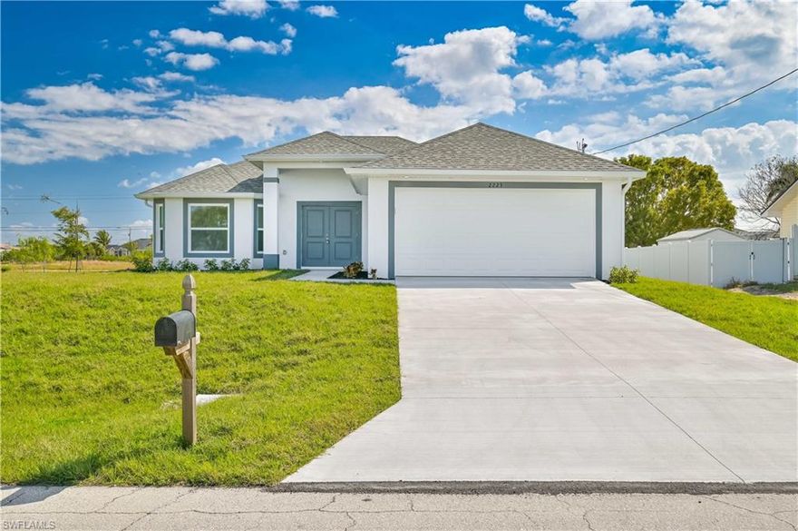 This brand-new 3BR, 2BA home is located on an oversized corner lot in a quiet residential neighborhood in the North Cape area. The home features tall vaulted ceilings and a fully-equipped kitchen featuring modern shaker style cabinets, quartz countertops, and top-of-the-line stainless steel appliances. The impact windows were a top priority for this build and flood the space with natural light. Convenience is key with a separate laundry room and a 2-car garage. The master suite features two spacious walk-in closets, dual vanity sinks, and a walk-in shower. Elegant tile flooring flows throughout. Spacious yard on oversized lot with large patio and lanai. Proximity to major corridors like Kismet Parkway, Del Prado, and Diplomat ensures easy access to amenities.