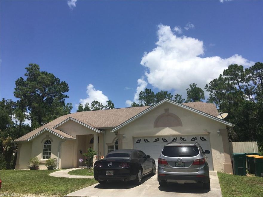 BACK ON MARKET****Must see home. Beautiful spacious open floor home on 2.27 acres of land. Plenty of room in the back for a pool. Enclosed patio with a barbecue area on the outside. Home boasts 4 bedrooms / 2.5 baths with tile throughout. Large Kitchen area. Separate entrance to guest bedroom & 1/2 bath. New Roof approximately 2 years old and the air conditioner is approximately 2 years old. Close to Golden Gate Blvd; shopping and restaurants. Easy to show vacant on SupraKey.