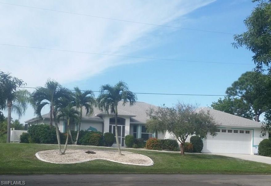 Prestigious Benfield home built with many extras, over sized garage, double insulated, roll up shutters, easy to use shutters on all windows. This spacious 3 bed room 2 bath home located near center of island in Bokeelia. You will enjoy the heated (heat pump) pool with a screened lanai. The back yard view is private with a palm tree plantation as your back neighbors. This home has been well taken care inside and out, Large half acre lot with established landscape.  You will not be disappointed, call to see your dream home, priced right to sell quickly.