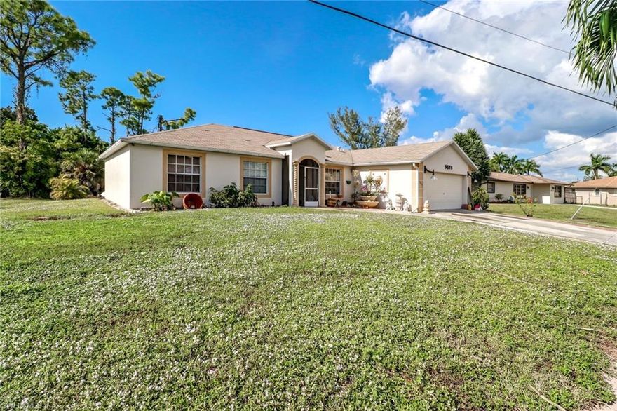 Great opportunity to own this great home at a remarkable price in Golden Gate City. Plenty of room on this home with 1,682 of living space. That’s right… 1,682 sqft under air for this price on a canal!  Home is completely tiled with the exception of 1 bedroom which has wood laminate flooring.  Central location close to shopping, dining and I-75. Minutes to beaches and best of all No HOA fees. This home will not last... Call today for a showing!