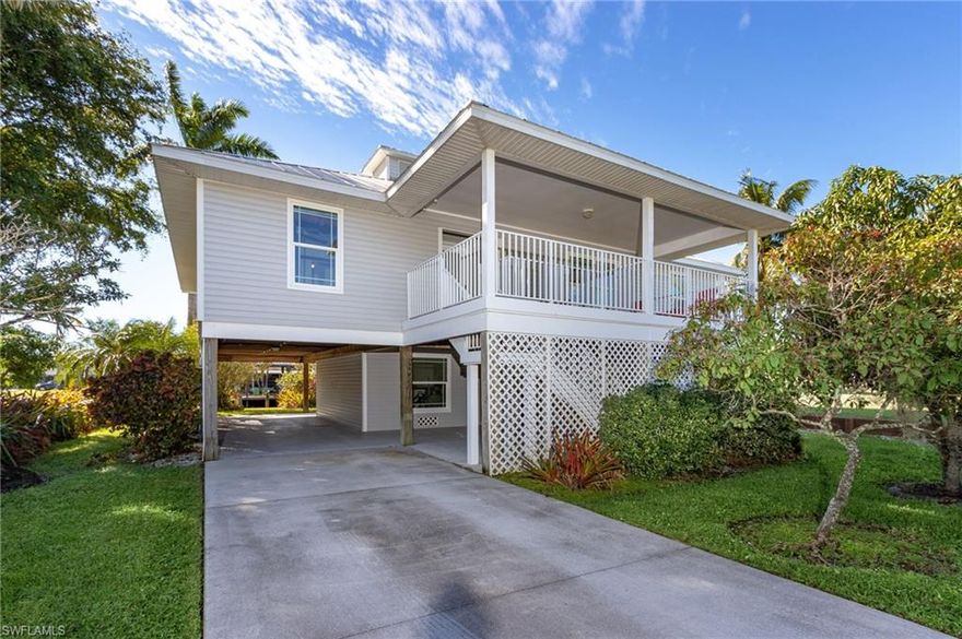 Location, Location, Location! This charming stilt sits on one of the best, widest canals in all of Pine Island. Only minutes from Charlotte Harbor, this home features a large boat dock with two boat lifts.  Inside you will find three bedrooms, two baths, a large kitchen/dining room and not a speck of dust anywhere.  Below is a large storage/workshop area with plenty of room for your kayaks, tools or whatever.  There is plenty of room to add a pool.  You can move right in and start enjoying the relaxing lifestyle that Pine Island is known for.  There is some of the best fishing in the US, many nearby restaurants to visit by car or boat (Cabbage Key), and large, mostly uninhabited islands surrounded by gorgeous beaches just waiting for you to visit.  Check out the photos and the virtual tour, and you will agree.  This is paradise!