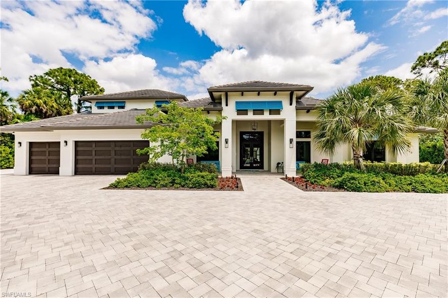 Located in one of the most desired neighborhoods in Naples, this home has all the luxury touches, starting with the custom designed front entry door, custom tray ceiling designs, and custom Legno Bastone wide plank flooring throughout the house, this home won’t disappoint.  Situated on 1 acre of land and offering 5 bedrooms + office, 4 and a half bathrooms, 4 car garage, and 4,532sf under air, this home is perfect for a large family.  The kitchen is in the center point of the home, equipped with a large center island and Thermador appliances.  Enjoy entertaining guest with two large living rooms opening to 746sf of covered outdoor living area with custom pool/spa, outdoor kitchen, and gas linear fireplace.  Have your overnight guests stay privately in the upstairs living quarters with bedroom, separate bathroom, and Key West style loft.  Walking distance to the beautiful sandy beaches at Vanderbilt or Clams Pass, and Waterside Shops with dining and shopping, makes this home highly sought after. This Pine Ridge Estate home was completely renovated to the concrete slab in 2018.  Treating the project as a renovation vs new construction kept the tax bill extremely low.