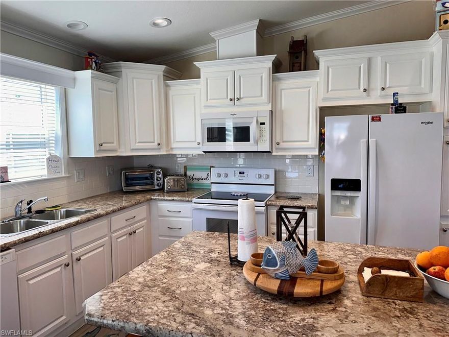 Welcome to your dream waterfront property in the charming Pine Island community of St. James City! This NEWER 2018 home is being sold furnished with beautiful coastal décor and offers Gulf access along with breathtaking water views. Boating enthusiasts will appreciate the dock featuring a new 7,000 lb boat lift with canopy, an additional lift for kayaks, and a convenient fish cleaning station—perfect for enjoying the island lifestyle. Recent upgrades include a new HVAC system, water heater, upgraded kitchen appliances, impact windows, a newer dimensional roof, and upgraded spray foam insulation installed underneath the home in 2023 for added efficiency and durability. A carport and screened lanai provide additional comfort and functionality for outdoor living and entertaining. The home sits at a nice high elevation, offering added peace of mind. Just bring your toothbrush and move right in to start enjoying the relaxed waterfront lifestyle that makes St. James City so special.