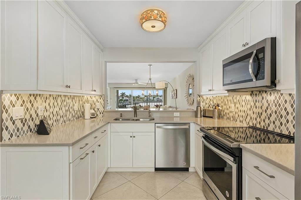 Photo of 10682 Gulf Shore DR #C-201, NAPLES, FL 34108 (MLS # 223087700)