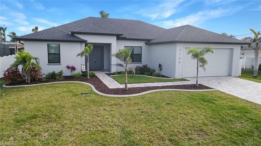 WHY build? This 2020 Beattie Development home is better than new and in an incredible SW location!  From the minute you enter the home, you will fall in love with the tile floor throughout and the warm character added by the beautiful electric fireplace and stunning tiled wall. The living area offers custom crown molding with lighting, plantation shutters, and a power roll-down window covering for the sliding doors. The cook of the home will appreciate the functionality of the kitchen with stainless steel appliances, a pantry cabinet, a pull-out trash cabinet, a garbage disposal, and a self-cleaning oven.

The master bedroom offers 2 large walk-in closets, space for a sitting area, and includes doors leading to the lanai.  The master bath has dual sinks, a large walk-in shower, and a private WC.  The shower and WC also have grab bars for safety.

This home has incredible outdoor space with a custom extended lanai.  The heated pool with overflow spa/ waterfall and smartphone controls make enjoying your large privately fenced yard a dream. In the evening the landscape lighting can be easily changed to the color you prefer via remote!  Schedule your appointment to see it today!