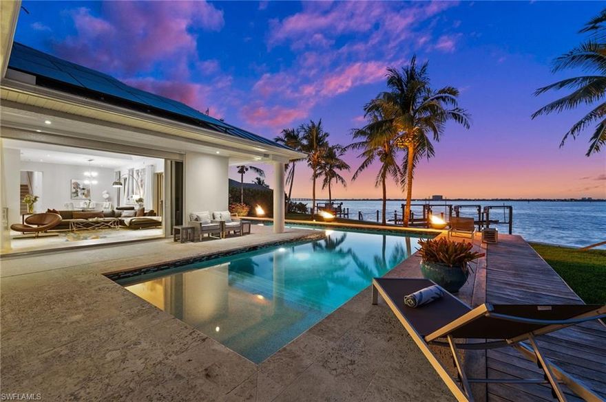 A rare riverfront gem in Cape Coral’s best location! Located directly on the Caloosahatchee River with 140 feet of waterfront in a cul-de-sac surrounded by the most stunning multi-million dollar houses, this spectacular estate captures glorious sunrise views every morning. With 4,299 sqft of living space, this home offers 4 spacious bedrooms, 5 full bathrooms, and a versatile den that can easily convert into a 5th bedroom.

This property is within walking distance to Cape Coral’s beach and Yacht Club, and just minutes from downtown and the Bimini Basin – offering the perfect blend of tranquility and accessibility. Set on one of the largest riverfront lots in Cape Coral, this home provides exceptional space, privacy, and an unparalleled waterfront lifestyle.

A beautifully designed two-story home extension added in 2015 includes a private guest suite with its own breakfast bar and breathtaking river views – perfect for hosting or multigenerational living. The rest of the home has been completely remodeled with luxurious finishes and top-tier upgrades throughout.

Enjoy the ultimate Florida lifestyle with a heated pool, outdoor kitchen, and gas fire features that create an enchanting riverfront ambiance. The brand-new dock with two 16,000-pound boat lifts is ready for your waterfront adventures. Additional highlights include a new metal roof, solar energy system, hurricane impact windows, Kevlar hurricane shutters, central vacuum system, and an insulated, climate-controlled attached garage with split A/C – ideal for a workshop, gym, or hobby space.

This exceptional home offers a rare combination of luxury, location, and lifestyle – the perfect riverfront retreat.