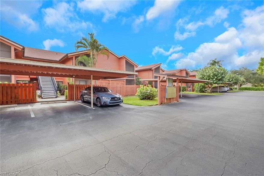 NAPLES HIDDEN GEM!  End Unit 2nd floor condo has 2 bedrooms, 2 full baths and updated!!  Kitchen has white cabinets with newly updated quartz countertops. stainless steel appliances, breakfast area, pantry, built in buffet and porcelain tile flooring. Master bathroom offers dual sinks, updated tile, flooring , cabinet with pull out and new light fixture.  Guest bath partially updated has a tub & shower. Spacious master bedroom with beautiful tile flooring. This light and bright  open living is area is adjacent to dining which makes entertaining easy!!  A/C replaced in 2013 and hot water in 2014. Impact windows in the front and back of the condo installed in 2025. Covered parking a plus!  Lanai has southern exposure with an expansive view! Spectacular location minutes to beaches, shopping, restaurants, Publix and Strada at Mercato and more.