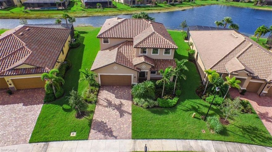 Lakefront pool home with spa and 1st floor master bedroom!  Relax in your saltwater pool or have dinner under the large covered lanai area and enjoy the lake view.  AS you enter this home you will be impressed by the cathedral ceiling in the foyer and dining room.  Large tile throughout the 1st floor, great floor plan for entertaining with the kitchen right off of the family room and breakfast room.  Kitchen features granite counters, custom stone backsplash, stainless appliances and wood cabinets.  Large master bedroom offers his and hers walk in closets and attached bathroom has separate tub and shower and dual sinks.  Upstairs has a huge loft which is like another family room and 3 bedrooms and 2 baths along with the laundry room!  Great curb appeal with tile roof and concrete paver driveway.  2 half baths, 1st floor and pool!  Preserve at Corkscrew amenities offer something for everyone!  Resort style pool with spa has covered cabanas, great tennis courts, state of the art exercise room, yoga room and great room for parties!  Close to shopping, dining, interstate, beaches, university and airport!  Association fees include lawn maintenance and all of the great amenities.