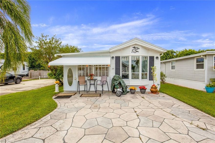 BACK ON THE MARKET!!  The buyer's financing fell through. This home has a new partial roof, new siding, new awning and BRAND NEW PLUMBING AS OF CHRISTMAS WEEK!  There is a ramp as you enter the home and grab handles installed if you are a little unsteady on your feet. This home is a very short walk to the satellite pool! You will find yourself relaxing in the comfortable living room enjoying the view from the front window. It is located in an active 55+ community where you own the land. There is so much to do!  Tennis, pickleball, fishing, cards, bingo, dances, potlucks and so much more. Some activities have been put on hold due to covid.  Only about 8 miles to Marco Island and 12 miles to downtown Naples.  A couple of miles to Walmart, Publix, CVS, Walgreens, Aldi.