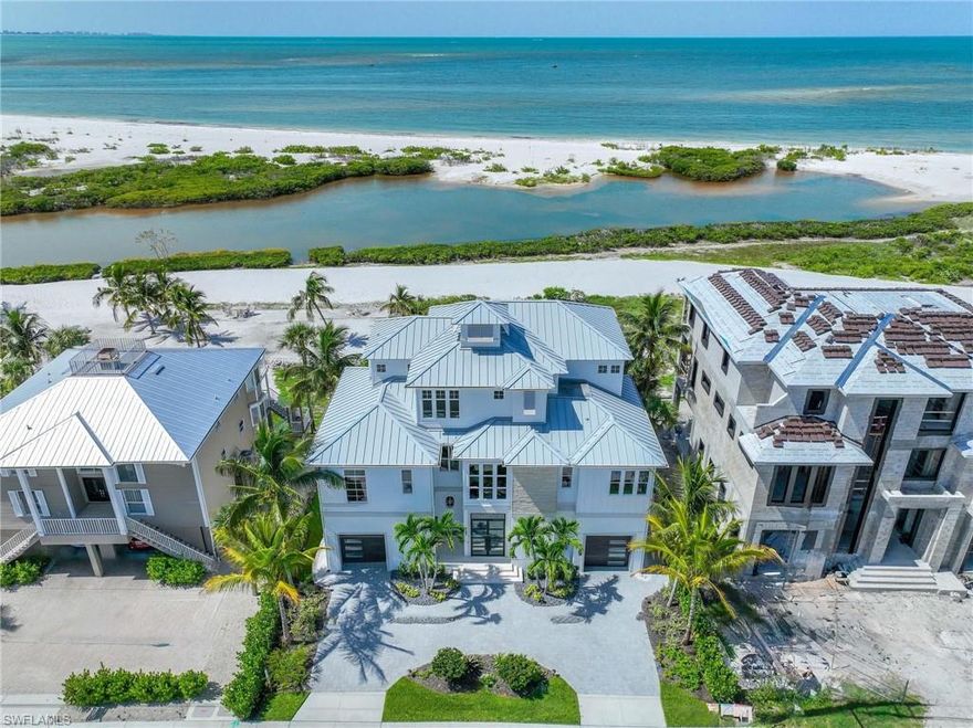 OFFERED FURNISHED! Enjoy the Gulf & Beach front lifestyle to its fullest with this newly remastered (ALAIR Custom Homes 2023/2024) coastal living, custom pool home. Originally built in 2015 by Gary W. Lau Inc. Custom Homes, here's the lifestyle you've always wanted & deserved with the scenic, stunning, unobstructed, shimmering views of the Gulf of Mexico right out your back door. From the moment you step into the foyer & take your private elevator or the custom-built staircase to the other levels, you know this is a special place for sharing with family & friends. As the home unfolds before you, your immediate focus may take you to the awe-inspiring expanded views of the Gulf of Mexico, its powdery-white sandy beach or the contrasting multi-shade turquoise gulf waters. Perhaps your eyes capture the spacious living room with coastal crisp décor’, natural sunlight, custom architectural ceilings, & the sprawling open floor plan. Then again, you may divert to the well-appointed kitchen that any chef would envy with new SS appliances, propane gas stove & oven, new tailored cabinetry, quartzite counter tops, glass-tiled backsplash, walk-in pantry & custom wood & tile flooring. Then again, it may direct you to the elevated pool & spa, the outdoor kitchen & lanai complete with gas fireplace & circular stairway to ground level where an outdoor shower, gas fire pit, direct access to the beach & gulf waters await you. Whichever, you'll be captivated & know, there is much more yet to see. Each of the 4 bedrooms are ensuites & there is a separate powder room as well. Custom closets, day-bar on both the 2nd & 3rd levels add to purposeful function & convenience. The list goes on, western-facing 3rd floor open balcony, 6-car garage, generator, electric hurricane shutters on the west-side of the home, impact resistant windows & doors, heavy gauge metal roof, new A/C, Security System, 350-gallon propane tank, new pool equipment & concrete block construction. The lot extends approximately 740' to the high-water mark on a select stretch of beach. The adjacent "buffer-zone" & designated bird sanctuary is home to Osprey, Eagles, Spoonbills & Pelicans along with a variety of other species that are indigenous to Florida to come & go as they please. The home has a set-back position from public beach goers, offering the utmost in privacy. Sunsets, as well as the distant lights of Naples, Bonita Beach & Sanibel on clear nights, add to the ambiance & will sweep you into your own oasis.