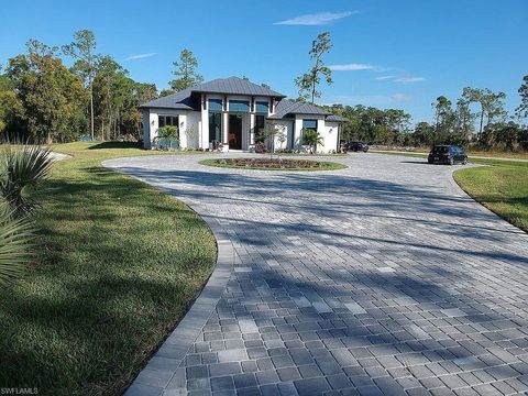 Photo of 6423 Livingston Woods LN, NAPLES, FL 34109 (MLS # 226015220)