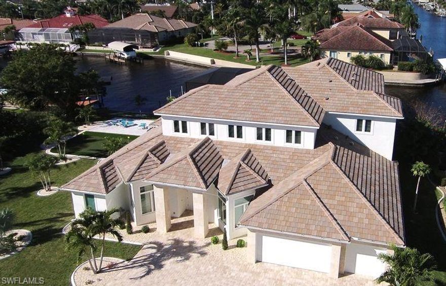 This Exquisite Home sits on just under a 1/2 Acre Homesite with 140 Ft. of Deep Sailboat Access Water Frontage, Minutes to Open Water, Western Rear Sunset Exposure, 2 Wrap-around Docks with 16k & 7k Lb. Lifts, a Kayak Launch, a Putting Green, and a White Sand Beach to soak up the rays! The home itself is PURE LUXURY, and would make an incredible full or part-time residence, or a major income producing vacation rental. The home is loaded with high-end features and finishes that are truly too numerous to list. With over 5,300 square feet of air-conditioned living area, there is plenty of room to spread out or entertain. There are two enormous Master Suites on the 1st floor, and 3 Large Guest Suites (all with private baths) on the 2nd floor. 5 Bedroom Suites in total, plus an additional Den/Office, a Large Fitness Room that can easily convert to a 6th Bedroom, and a Lounge Area with a Pool Table. Incredible Outdoor Area with a Stunning Pool & Spa, and Outdoor Summer Kitchen for cooking poolside! This home is being offered Turnkey Furnished to make your move even easier. Additional Features List supplied upon request. Don't let this one slip away! Secure your "Piece of Paradise" today!