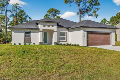 Photo of 392 Charwood AVE S, LEHIGH ACRES, FL 33974 (MLS # 226029040)
