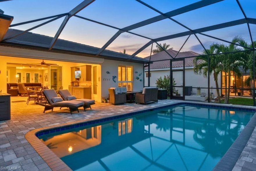 Welcome to one of Southwest Cape Coral's finest where it’s like living on vacation everyday. A golf cart ride away from 10+ restaurants and surrounded by multimillion dollar waterfront homes. A meticulously crafted contemporary home nestled among million-dollar estates and swaying palms. Better than new in every way, this residence was designed for those who refuse to compromise.
Inside, soaring volume ceilings and an open-concept layout set the stage, grounded by gleaming porcelain tile floors and framed by classic plantation shutters. Crown molding and tray ceilings lend an air of quiet elegance to the living areas and owner's suite. The chef's kitchen is a showpiece — KitchenAid stainless steel appliances, soft-close cabinetry with pull-out shelving, quartz countertops, and a dramatic waterfall island with disappearing outlets.
The extended owner's suite offers a private sitting area and direct access to the screened lanai and pool. A thoughtfully designed guest suite — complete with a den, two bedrooms, private bath with pool access, and a pocket door for total separation — ensures family and visitors feel equally at home. Every bedroom features walk-in closets and a ceiling fan.
Outside, a covered lanai (approx. 20' x 14') with a Kevlar storm screen opens via sliders to a stunning 13' x 26' pool set on an expanded paver deck perfect for sunbathing. A privacy fence from the rear neighbor completes the retreat. Oversized laundry room with abundant cabinetry and a dedicated refrigerator. No HOA. This is SW Cape Coral living at its absolute best.