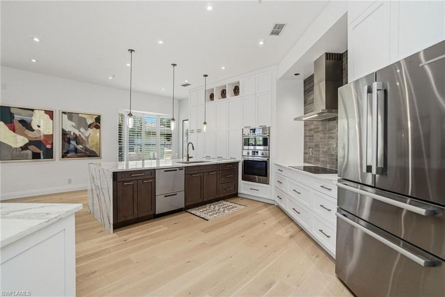 Welcome to refined coastal living in the highly sought-after Les Chateaux enclave within Pelican Marsh. This beautifully renovated second-floor residence offers a rare blend of architectural volume, modern design, and serene natural surroundings—all in one of Naples’ most desirable locations.

This airy residence features extra-high ceilings and windows on three sides, filling the home with natural light and creating a bright, open ambiance. The thoughtfully designed layout seamlessly connects the kitchen, dining, and living areas—perfect for both everyday living and entertaining. Mirage light oak engineered hardwood flooring, modern trim, and designer lighting complete the clean, contemporary aesthetic throughout.

The showpiece kitchen is truly the heart of the home, highlighted by a dramatic 9-foot waterfall island, abundant storage, and a premium appliance suite including a Bosch microwave/combination wall oven, French door/2-drawer Bosch refrigerator, 36" five-zone induction cooktop, stainless steel hood fan, Fisher & Paykel two-drawer dishwasher, washer and dryer, garage opener, Ring doorbell, and Nest thermostat—ideal for both hosting and everyday living.

Enjoy expansive pond views teeming with wildlife from the main living areas, offering a peaceful, private backdrop. Guest bedrooms capture charming views of a community fountain, adding to the home’s tranquil setting.

A rare and highly desirable feature, this residence includes a detached double garage with a private covered walk-up and front door entry. Furniture and accessories are negotiable.

Residents of Les Chateaux enjoy access to a private pool and fishing ponds, along with a short walk to the Pelican Marsh Golf Club. Beyond the enclave, Pelican Marsh offers beautifully landscaped boulevards and a vibrant lifestyle center featuring pickleball, tennis, bocce, a fully equipped fitness center, group classes, and a full calendar of social events—all included in the HOA. Xfinity TV (125 channels) and high-speed fiber internet are also included.

Enjoy an active, resort-style lifestyle in Pelican Marsh, offering tennis, pickleball, bocce, a fully equipped fitness center, spa services, an on-site restaurant, and a full schedule of social and community events. Perfectly positioned just minutes from Mercato, Waterside Shops, and Artis—Naples, this exceptional property offers the ideal combination of luxury, lifestyle, and location.