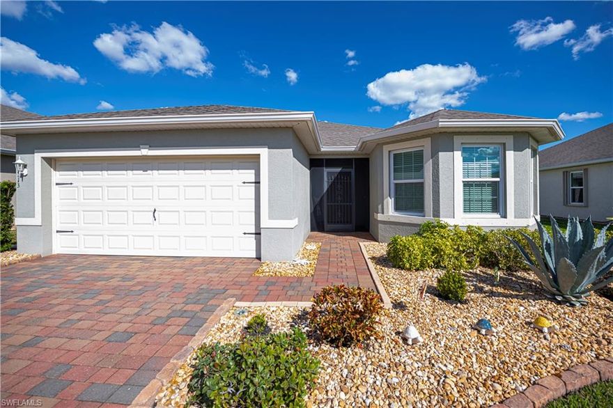 This charming 2019 well cared for 3/2 Eastham floorplan with 1747 sq.feet of comfy living, is in the gated Village of Entrada with LOW HOA fees, NO CDD, priced to sell and move in ready!  Dine with a great view out of the front Bay Window, or while relaxing on your Super Screened back lanai enjoying the tranquil POND complete with fountain, tropical birds and wildlife.  UPGRADES include: 9 Impact Windows & Slider, Generlink generator hook up, Overhead Garage Storage Rack, SMART HOME - Alarm, Remote Door & Thermostat Control, SAMSUNG Appliances, vibrant backsplash, fresh lightly hued paint on walls, color seal grout on all ceramic tile, decorative light switch plates and lighting.  Plenty of curb appeal with ST. AUGUSTINE grass, Screened in front entry with wrought iron door, gutters, Brick Curbing with Rocks, Palm & Bottlebrush trees, new irrigation, EXTENDED PATIO PAVERS, paved trash pad, with a bonus of all pavers freshly cleaned and sealed.    

Truly savor sunny Florida in Entrada with it's variety of resort style amenities: complete with beach-style entry and lap pool, pickleball, tennis, bocce ball, & clubhouse/gym with golf cart parking spaces for your convenience. Plenty of fun available with many social groups/activities & food truck visits. Conveniently located with easy access to downtown Ft. Myers and the no toll bridges, shopping, movie theatres, live theatre, & restaurants!