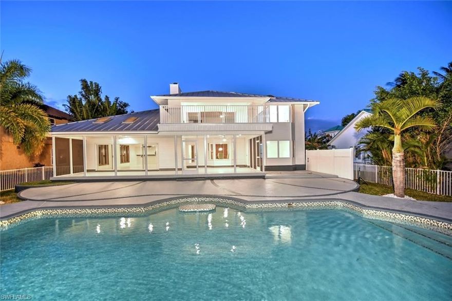 New: now with open concept kitchen and dining, back on the market after additional modifications.
Unique, luxurious riverfront estate with southern exposure and a wow factor. It is fully renovated and you can move in at closing. This house offers the residents plenty of space and privacy. The house is also perfect for large pool parties. There is a direct River/Gulf access with 2 boat lifts offering great water sports opportunities. A place where dolphins meet and where you can see the sunrise. This luminous house has been remodeled with new bathrooms, appliances, plumbing, HVAC, and many other features. Everything is freshly painted inside and out and new tiles are laid throughout the house (except for the master bedroom on the upper floor). This stunning home awaits its new owners, and you can even host friends as there is a guest suite and a guest room. There is also a stately office/den and a fitness room. The master suite on the top floor is to die for. In addition to the tremendous and stunning view from the bedroom, there is an immense terrace with a wet bar, and the size of all adjacent rooms is incredible. You should see the bathroom or the walk-in closet for that matter... Your journey begins at this gorgeous villa.