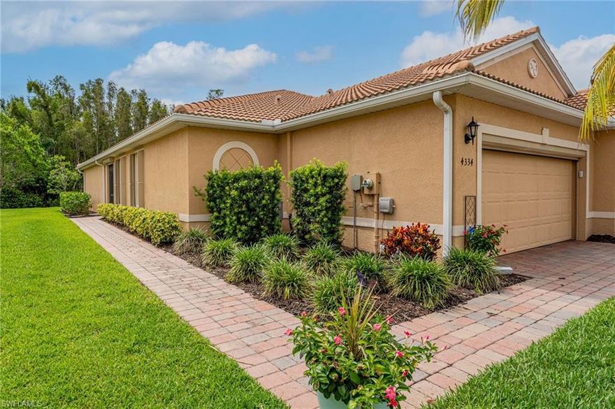 Great opportunity to own this spacious 2 bedroom plus den attached villa that is on a rare, oversized pie-shaped lot with a private landscaping view. This home offers tons of natural lighting and an open concept. The kitchen boasts granite countertops, stainless steel appliances, tile backsplash and pantry. The kitchen overlooks the dining room and living room with private wooded area views. The spacious primary suite offers two walk in closets, dual vanities and a large shower. Interior was just painted. Tile throughout - no carpet! Storm protection consists of 2 hurricane roll-down's and accordion shutters. Hot water heater replaced 02/26. Salt-less water filtration system. UV light in AC handler. Epoxy garage floor. Entire home gutters. The highly sought after Lindsford community is gated and offers a resort style pool, spa, fitness center, bocce ball court, basketball court, tennis court, play ground, playroom and kitchen in the clubhouse. Take a walk or bike ride on the John Yarbrough that goes right through the neighborhood. Low HOA dues include the amenities and lawn care. This spectacular community is located in one of the most sought after areas of Fort Myers with close proximity to I-75, tons of shopping and dining options, Top Golf, beaches, downtown historic district, beaches, RSW Intl Airport so much more!