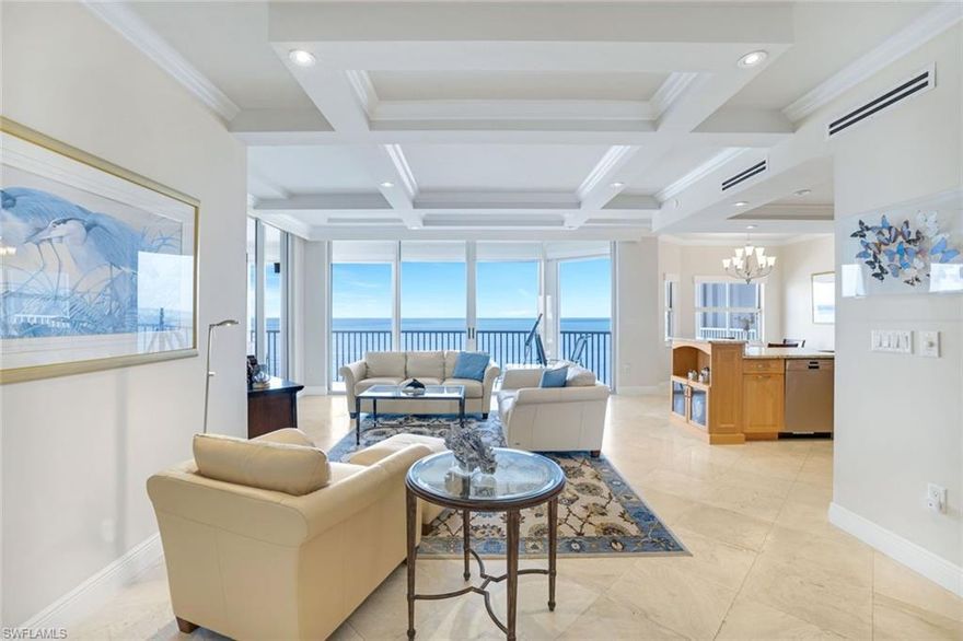 RARE OPPORTUNITY!  Anchored on the coveted SW corner of the 8th floor, this 3/2 end unit has been rebuilt for effortless coastal living. The moment you step inside, floor to ceiling Gulf views take center stage, framed by soaring 9'6" coffered ceilings and an open layout where kitchen, dining, and living areas flow together as naturally as the tides. Rest easy knowing the wiring and plumbing aren’t original—both were overhauled long after the building’s debut—while the living area flows seamlessly into an open kitchen modernized for today’s chef. Hurricane impact rated electric shutters stand ready at the touch of a switch. Ceiling mounted speakers keep the soundtrack breezy no matter the playlist. The split floor plan lets the primary suite luxuriate alone on the beachfront side, while two guest bedrooms soak in sweeping bay and city light vistas—everyone gets a view and their own slice of privacy. Downstairs, a deeded private garage shelters your car with some extra room for storage. Sea Chase itself is an intimate, gated enclave of just 31 residences, complete with a beachside pool, pet friendly policies with limits, and rental rules that protect both peace and property values. From your front door, it’s a quick stroll to LaPlaya, Turtle Club, and access to the best shopping and dining Naples has on offer. If you’ve been waiting for a turnkey, three-bedroom gem where morning coffee arrives with dolphins and evening cocktails unfold beneath spectacular sunsets, congratulations—you’ve just found your new home.