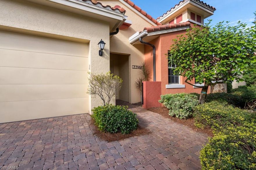 The most popular floorplan in the Villas because of the open concept and wall of sliders opening out to the pool. .Just painted neutral color throughout.  Kitchen features Granite counters, stainless steel appliances center island, ample cupboard space, and a large pantry. Travertine marble floors throughout living area. Brand new washer/dryer, year old dishwasher, hot water heater & pool pump. Master bedroom has a oversized closet and sliders  leads out to brick paver lanai & pool. Master bath has a large walk in shower & garden tub.  Garage complete with 220v power junction box for charging electric cars.  Beautiful sunsets over lake & fountains from your Great Room  and Lanai. Rapallo is a Mediterranean style resort community with luxury amenities such as two lagoon style pool with rock grotto waterfalls and spa,  screened jr Olympic lap pool,clubhouse with full catering kitchen, library, bocce ball, jogging and bike paths 5 har tru tennis courts, full  time tennis pro, fitness center, full time fitness director, Activity director, fishing piers, Botanical gardens, best part walk to the Coconut Point Mall with restaurants stores . $5000 flooring allowance for bedroom carpet