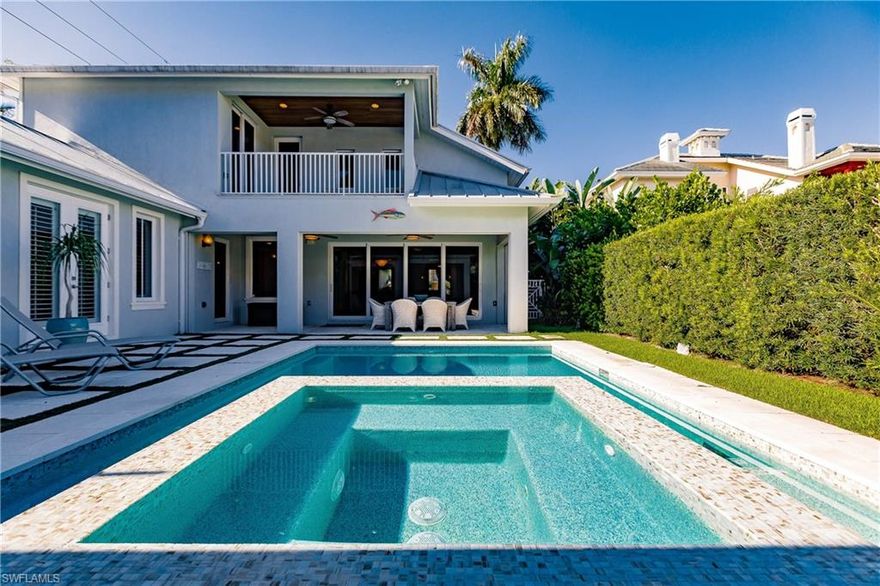 ABSOLUTELY NO HURRICANE DAMAGE!  This home is located in the highest elevation in the Olde Naples area. Old Florida style meets Coastal Contemporary in this 4-bedroom, 5-bathroom home, sitting in the heart of Olde Naples. Enjoy all Naples has to offer, with only 4 blocks to the beach and 4 blocks to Fifth Avenue’s upscale shopping and fine dining. The home features a split floor plan, with a secondary master suite overlooking the pool. The spacious gourmet kitchen and breakfast bar flow graciously into the dining area and family room, perfect for entertaining. A large den provides an easy space to work from home. Sliding doors open up to a beautiful outdoor living area, complete with a summer kitchen, fireplace, and a heated pool and spa. You will find meticulous architectural craftsmanship throughout, including a private elevator.  Don’t miss the opportunity to make this your dream home or private beach getaway!