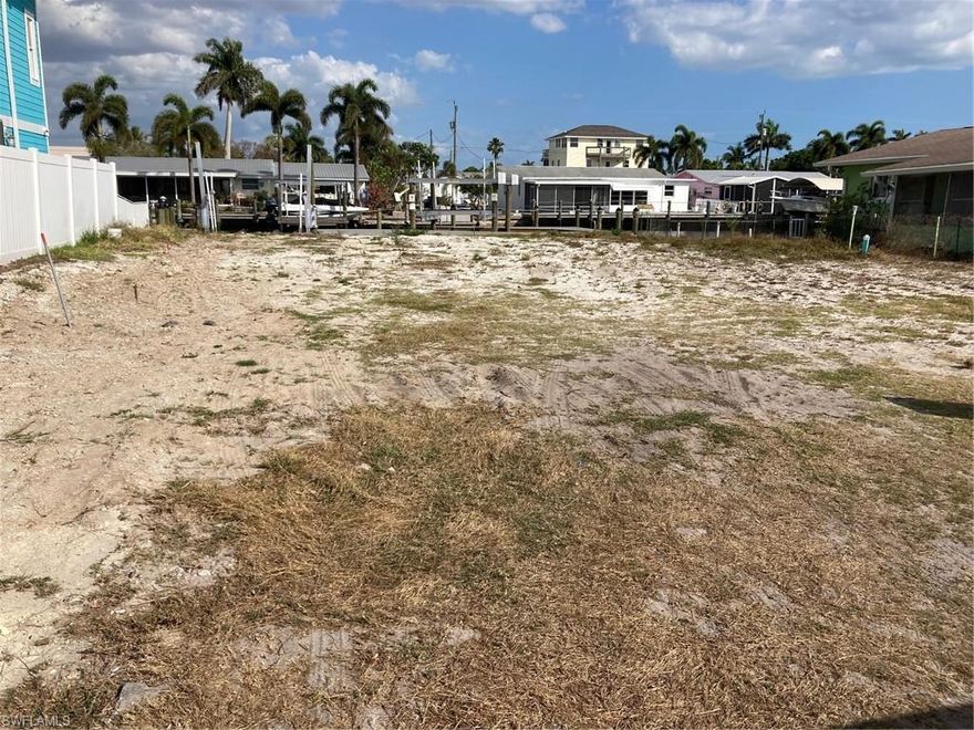 WOW! OWNER FINANCING!! AMBERJACK HARBOR, CLEARED 60FT. WIDE LOT southern exposure, WITH DIRECT GULF ACCESS, NO BRIDGES, DEEP WATER DOCKAGE, NEW SEAWALL, NEW WRAP AROUND COMPOSITE DOCK WITH NEW REMOTE CONTROLED 10K LB. BOAT LIFT AND 2 JET SKI LIFTS, WATER AND ELECTRIC @ DOCK, MINUTES AWAY FROM BOCA GRANDE WITH THE BEST TARPON FISHING IN THE WORLD! READY TO BUILD ON, WATER AND SEWER, LOCATED IN MATLACHA, A KEY WEST STYLE AREA WITH SHOPS, RESTAURANTS, SHRIMP DOCKS,TWO PUBLIX SHOPPING CENTERS CLOSE BY, FORT MYERS, SANIBEL ISLAND AND NORTH CAPTIVA BEACHES MINUTES AWAY, NEW MULTI MILLION DOLLAR RESIDENCES UNDER CONSTRUCTION!!!!!  SURVEY PROVIDED SURVEY VERIFIES 60ft.X80ft. SURVEY COMPLETED PRIOR TO NEW DOCK AND SEAWALL INSTALLATION, 3 BED 3 BATH 3,068 S/F RESIDENTIAL PLAN AVAILABLE