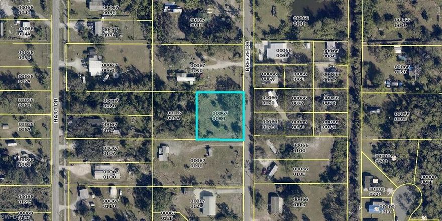 LOCATION, LOCATION, LOCATION!! Nice Oversized lot!!nestled under some gorgeous oak trees waiting
for you to bring your new manufactured home!, in or build a concrete block construction or a wood frame
home. Connect to the city water that is available at the lot site. There is a fire hydrant in the front of the
property by the road. Also, there a septic tank already on the property. Own your own land. Easy access to downtown Fort Myers,  I-75 SWFL International Airport, dinning, schools, grocery, shell Factory, merchants
crossing shopping center & more.