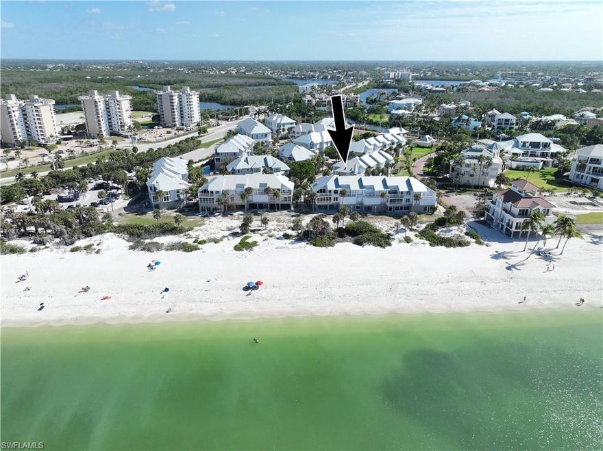 Rarely available direct beachfront villa in the Villas at Barefoot Beach. Single family ownership with HOA - you own the land. Collier County’s least expensive direct beachfront single family ownership property. This 3 story villa features 3 bedrooms, 3 baths, large great room, kitchen with casual dining & formal dining all with wide Gulf views, screened lanai with electric shutters, master bedroom plus private deck overlooks the Gulf & has large master bath. Lower level with two car garage large storage plus ground floor lanai.  Barefoot Beach is a guard gated community with 24 hour patrols. The Villas offer two swimming pools & a spa plus beach boardwalk & sunset deck on the beach.  Community pools are being renovated plus new landscaping.  Special assessments levied have been paid.