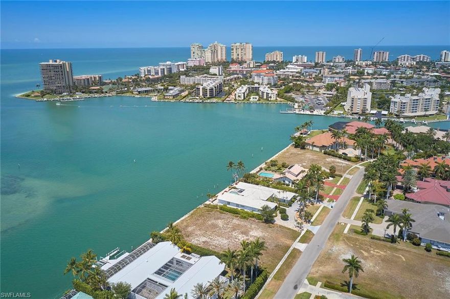 Incredible opportunity to own and build your dream home on this Gulf-side, half-acre, direct-access lot with south-southwestern exposure, stunning wide water views of Caxambas Pass, Gulf of Mexico, area islands and the city skyline in the distance. This homesite is ready to be built on with a newer seawall and is in the AE-11 flood zone, offering significant savings for insurance and construction. This property is located on the coveted Caxambas Island in the prestigious estate section of Marco Island, where you are surrounded by some of the island's most luxurious properties and representing an exceptional building site.