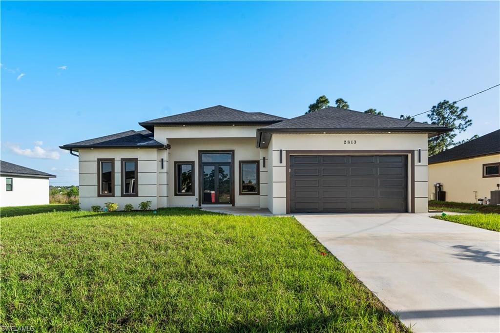 Photo of 2813 19TH ST SW, LEHIGH ACRES, FL 33976 (MLS # 226013712)