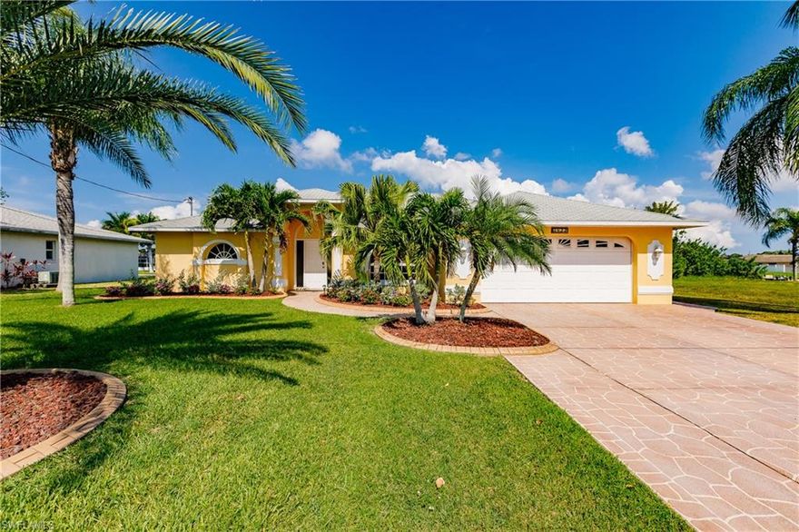 Wonderful Florida sunshine home. Immaculate! This house inspires Florida living, bright sunny, lots of living space. Beautiful intersecting canal views with western "Sunset" exposure. The location of this house is as central as you can come. For year-around residents it is close to everything, schools, soccer fields, base ball fields, shopping, restaurants , quick access to beaches. The canal allows access to a network of canal systems and lakes. The house is a 3 bedroom 2 bath, split floor plan. It has both a family room and a living room, formal dining room, Beauatiful Octagon type breakfast nook with wonderful views of the heated pool and the canal. The landscaping is park like with upgraded Curbing enhancing all the flower beads and other well manicured bushes and landscaping. Epoxy painted 2 car garage. Extra wide, 24 ft. Spraycrete driveway.