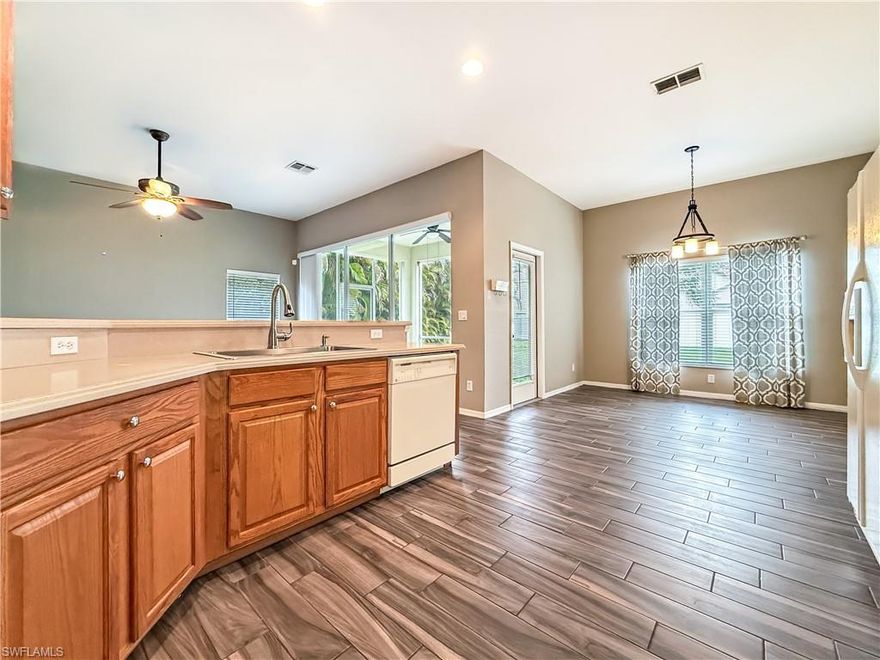 Welcome to Cypress Cay at Gateway! This well-maintained 3-bedroom, 2-bath single-family home is located in a non-gated section of the highly desirable Gateway master-planned community and sits outside of a flood zone, all while offering great value HOA fees. Step through the front door into a comfortable living space that flows naturally into the kitchen and dining area, creating an inviting layout ideal for both everyday living and entertaining. The kitchen features wood cabinetry, Corian countertops, and a brand-new sink, with plenty of workspace for cooking and gathering. The home also includes an in-house washer and dryer along with a spacious two-car garage for added convenience. The primary suite offers brand-new carpet and a generously sized bathroom with dual vanities, a soaking tub, and a separate shower. Sliding glass doors lead out to the screened-in lanai, where you can enjoy peaceful outdoor living while overlooking a spacious backyard with plenty of room to add a pool, giving buyers the opportunity to create their own private Florida oasis. Additional highlights include a new shingle roof installed in 2023 and a home that is completely move-in ready, making it easy for buyers to close quickly and start enjoying the Southwest Florida lifestyle. Gateway is one of Fort Myers’ most established master-planned communities, spanning more than 3,000 acres with over 30 unique neighborhoods and a wide range of recreational opportunities. Residents enjoy miles of walking and biking trails, parks, playgrounds, sports fields, and access to optional country-club amenities including golf, tennis, pickleball, fitness facilities, and resort-style pools. The location is incredibly convenient—just minutes from I-75, Southwest Florida International Airport, Gulf Coast Town Center, restaurants, shopping, and JetBlue Park, the spring training home of the Boston Red Sox. Gateway’s combination of accessibility, amenities, and community atmosphere makes it one of the most popular residential areas in Fort Myers. If you’re looking for a move-in ready home with space to grow in a vibrant Southwest Florida community, this Cypress Cay property is a fantastic opportunity.