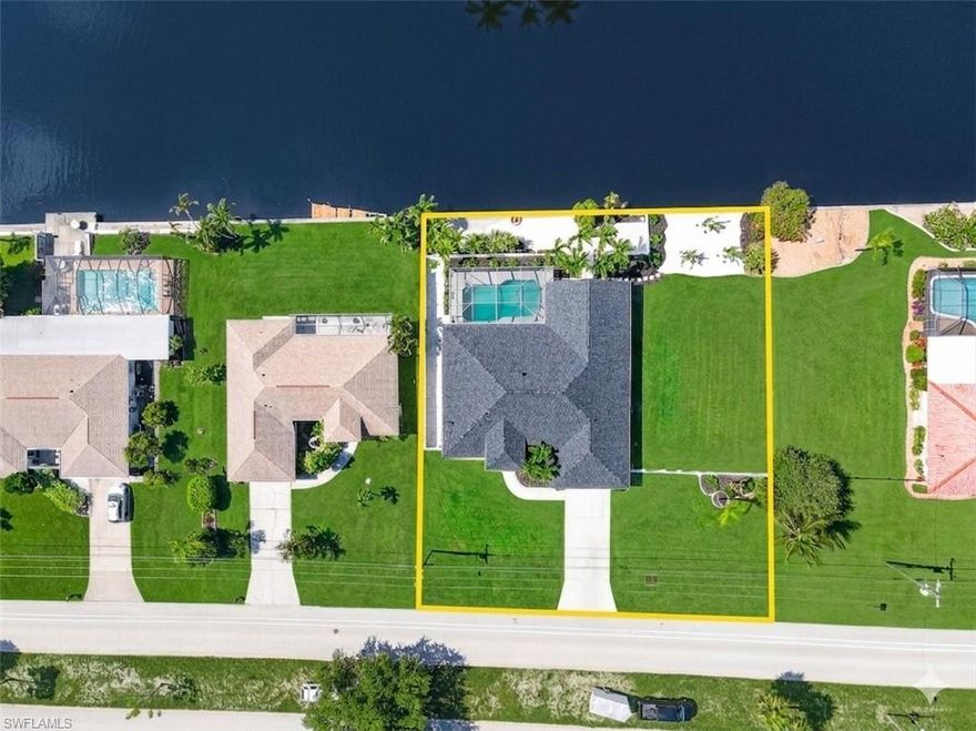 ***Southern Rear Exposure***Triple Lot***200-Foot Wide Canal***10-Minute Access to Open Water***
Experience exceptional waterfront living in this fully renovated, one-of-a-kind coastal retreat featuring a rare triple lot, 200 feet of wide canal frontage, and fast 10-minute access to open water. With coveted southern rear exposure, this property offers sun-drenched outdoor spaces and stunning water views all day long. Recently upgraded with a new roof, new A/C, and extensive renovations inside and out, this home blends modern luxury with timeless coastal design. Step inside to soaring ceilings and an open, airy floor plan highlighted by wood-look flooring, crisp white cabinetry, quartz countertops, and a striking blue backsplash that perfectly captures the Florida lifestyle. The expansive waterfront setting provides enhanced riparian rights, allowing for additional dockage opportunities rarely found in comparable properties. Enjoy your own private beach in the backyard, ideal for relaxing, entertaining, or launching your next boating adventure. There’s also ample room to add an RV garage or additional custom amenities, making this property as versatile as it is impressive. Whether you’re seeking a luxury waterfront residence, a boater’s paradise, or a unique investment opportunity, this exceptional home delivers it all. ***Check the comparable sales, this home is a STEAL, there is no markup for the Triple lot, 200ft wide canal, or southern rear exposure.. most of the other recent sales were selling for close to this list price and they were dated. This home is priced to sell and is the best deal on the market right now!!***