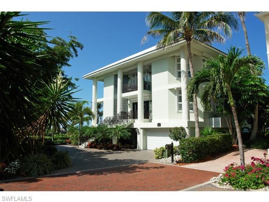 This completely renovated 3-story Barefoot Beach home is located on a 1st position direct beach front lot & includes 1/2 of the adjoining lot 2.  Enjoy panoramic gulf views from Sanibel to Naples plus a breathtaking beach garden and pool.  One of only 3 homes with a private walkway to the beach.  Features include stucco exterior, five bedrooms plus a den, five full and one half bath, electric shutters, beachfront decks, tile roof, private elevator and a media/entertaining room overlooking the Gulf.