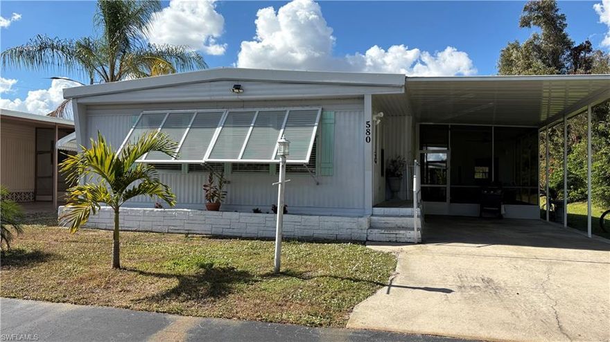 BEST VALUE in Lazy Days Village! PRICED to SELL & and ready for YOU to MOVE IN! Ideally located on a corner end lot on a quiet street with no through traffic, this thoroughly UPGRADED, METICULOUSLY MAINTAINED double-wide features 2 spacious Bedrooms, 2 beautifully, remodeled FULL bathrooms with showers, and over 1200 sf of air-conditioned living space.  A/C is 7 years old. Roof is solid. NEW stainless steel dishwasher, double-door refrigerator with ice, glass-top stove, microwave, and disposal in the bright & airy Kitchen. New electrical panel. New subfloors, and new laminate top flooring in the main living areas with plush neutral carpet in the bedrooms. Master BR has a big Walk-In Closet. This immaculate home may be purchased fully-furnished turnkey with TVs and all the beautiful new furniture. Washer/Dryer/laundry tub & storage are conveniently located in the breezeway shed. Awnings provide weather protection & energy savings. Own this unit AND your LAND while you Enjoy MAINTENANCE-FREE AFFORDABLE LIVING in the Sunshine State! Walk to the nearby heated swimming pool & enjoy a people-friendly, pet-friendly 55+ Community w/2 clubhouses, shuffleboard, ponds, parks, mature landscaping, street lights. Low-cost RV & boat storage available on-site! Life is good at Lazy Days! A great place to live year round or the PERFECT warm-weather getaway! LOW monthly fee $185 includes recreation facilities, common grounds maintenance & trash pick-up. Optional Park Share Certificate is available separately which will reduce the monthly fee from $185 to $85. Price to be negotiated between buyer & seller. (You own your land in Lazy Days whether or not you purchase the Share.) Don’t miss your opportunity to own one of the largest, loveliest homes in this people-friendly, pet-friendly established community! It will soon be time to harvest fresh fruit from the three orange trees in your back yard! SEE THIS ONE TODAY!