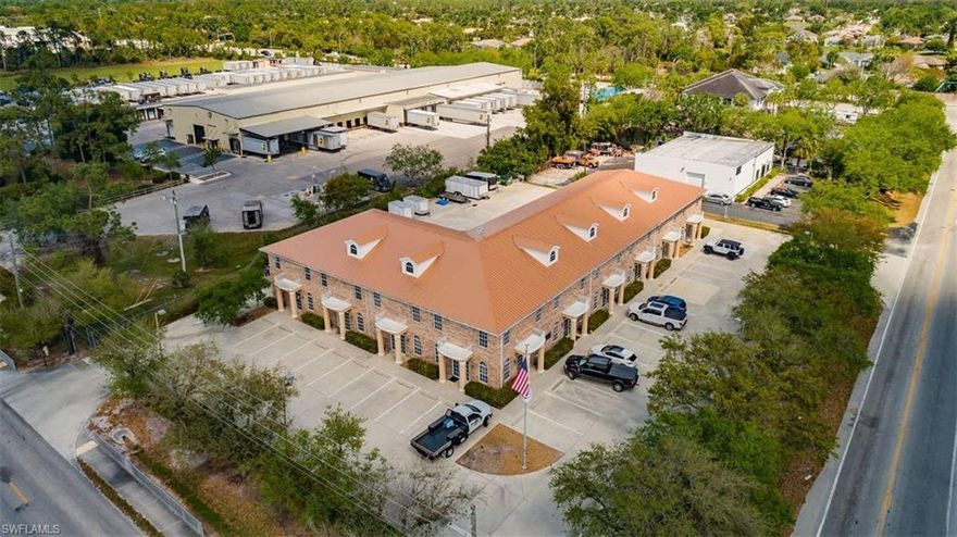 Income-producing property with 7 individual units ranging in size between 1200 and 5000 sq. ft. conveniently located within the Naples Production Park at the Northwest Corner of Enterprise Ave and Commercial Blvd. The building offers a two-story flex space with multitude of possibilities, like an elevator in one of the units, four 12'x12' and two 12'x8 overhead garage doors. Each unit has its own metered utilities, including central water, sewer and electric. The building is concrete block with Brick Facade and NEW Roof installed in 2015.  The property offers fenced parking area and yard with 6' chain link fence, and has a sign at the corner of the road for business banners.