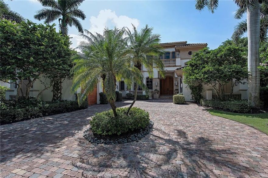 Enjoy long water views from this custom-built residence in the Moorings. Encompassing over 6,000 square feet under air, the spacious floor plan offers a chef-designed kitchen with an adjacent wet bar area, 5 bedrooms, a study off the master bedroom, an upstairs den and 6 full plus two half baths. The amazing backyard setting provides tropical ambiance, southwestern exposure, 120 feet of water frontage, features a large travertine deck with a pool/spa, covered grilling nook with TV and a lower deck leading to 21' dock with boat lift. Additional features include an added laundry area on the second floor, 4 garage spaces, automated shutters and much more. The Moorings offers a voluntary beach membership with private parking and restrooms for a nominal yearly fee.